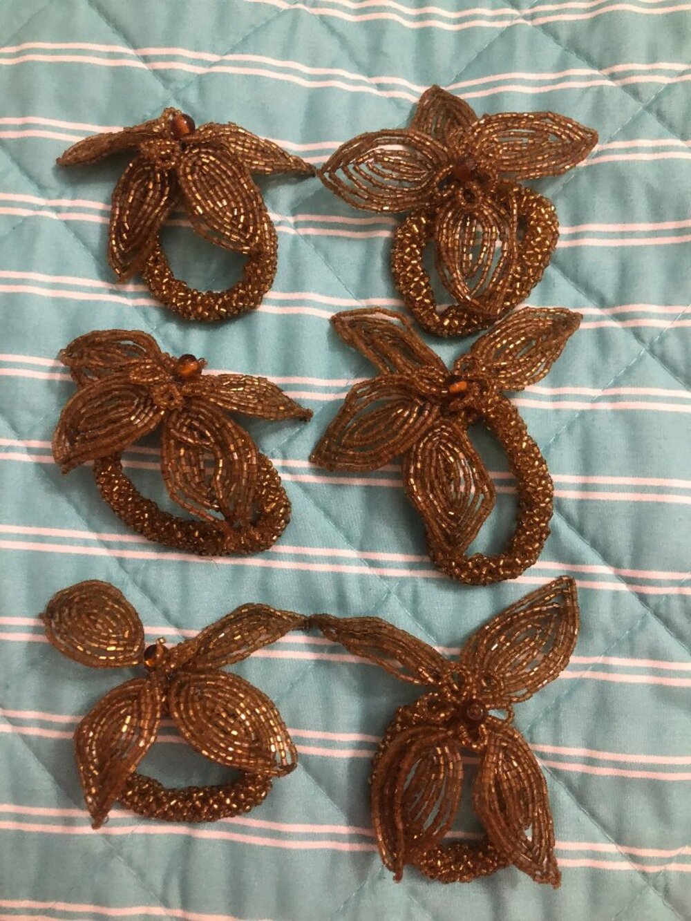 6 gold toned wire wrapped beaded napkin rings